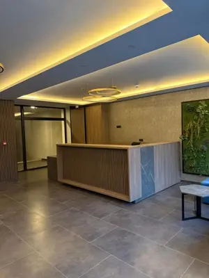 a lobby with a reception desk in a building at Alpina Lux in Kopaonik