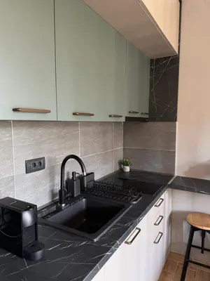 a kitchen with a sink and a counter top at Pine apartments Residence Hill in Kopaonik
