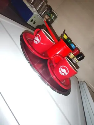 a pair of red electronics sitting on top of a refrigerator at Rola smeštaj in Paraćin