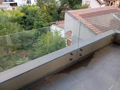an outdoor balcony with a view of a roof at Apartment Eleven in Niš