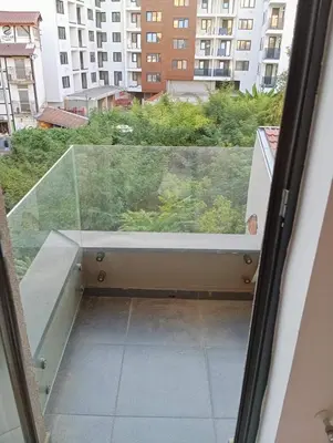 a glass window with a view of a building at Apartment Eleven in Niš