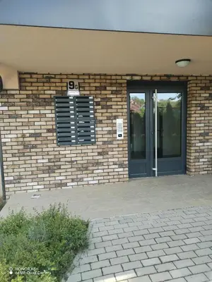 a brick building with a door and a window at Markovic san in Vrnjačka Banja