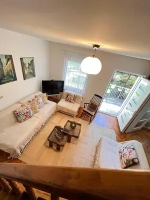 a living room with a couch and a table at Viva Sićevo