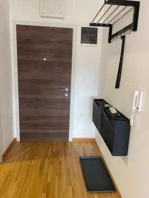 a room with a door and a wooden floor at Apartman Adamović in Vrnjačka Banja