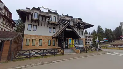 a building on the side of a street at Vila Mecava Centar in Kopaonik