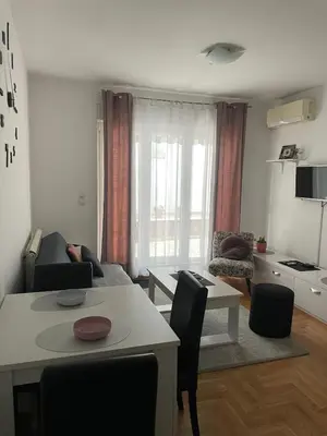 a living room with a couch and a table at Spice Apartment in Bukorovac