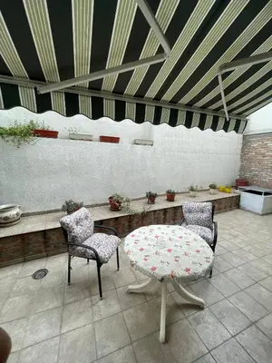 a patio with a table and two chairs at Spice Apartment in Bukorovac