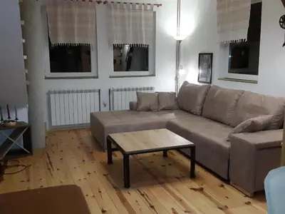 a living room with a couch and a coffee table at Apartments Casa Pavlovic in Kopaonik