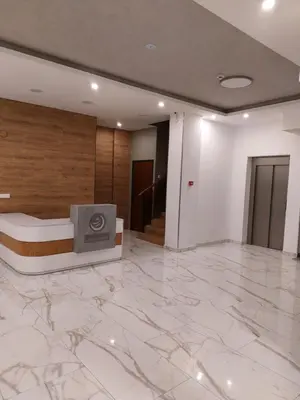 a hotel room with a marble floor and a tv at Jagodina studio CRNJANSKI zatvoreni bazen in Jagodina