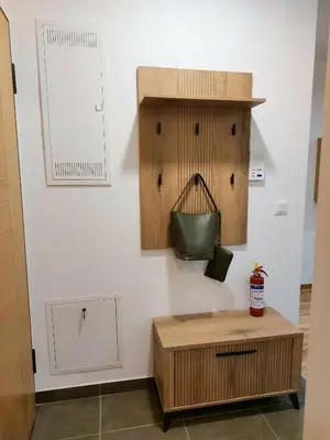 a room with a table and a purse on a wall at Jagodina studio CRNJANSKI zatvoreni bazen in Jagodina
