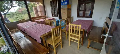 a room with tables and chairs in a room at Deda Bocin konak