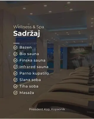 a room with a row of beds with words on the wall at A&N President Kop in Kopaonik