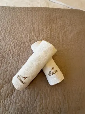 a pair of white socks on top of a bed at Apartman SEVN in Kopaonik