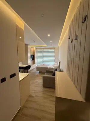 a living room with a couch and a table at Apartman SEVN in Kopaonik