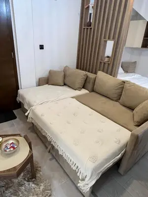 a living room with a couch and a table at Apartman PETKOVIĆ NLux 110 Milmari resort in Kopaonik