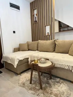 a living room with a couch and a table at Apartman PETKOVIĆ NLux 110 Milmari resort in Kopaonik