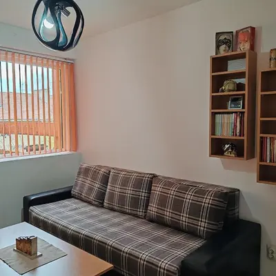 a living room with a couch and a table at Merak stan na dan in Vranje