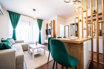 a living room with a couch and a table in a room at La Casa in Vrnjačka Banja