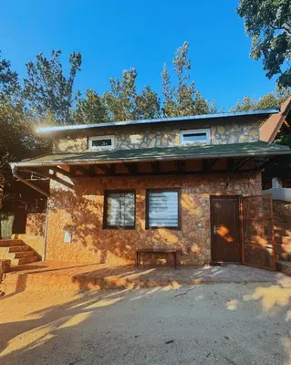 a brick house with a garage in front of it at Bovanska Oaza 2 - Bovansko jezero in Aleksinac