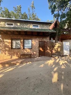 a brick house with a gate in front of it at Bovanska Oaza 2 - Bovansko jezero in Aleksinac