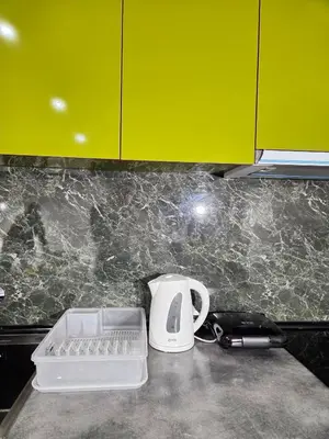 a kitchen counter with a toaster and a phone at Apartman Mist C113 - Bela Reka in Brzeće