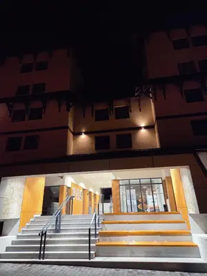 a set of stairs leading to a building at night at Apartman Mist C113 - Bela Reka in Brzeće