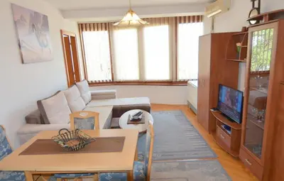 a living room with a couch and a table at Apartman Mandić in Vrnjačka Banja