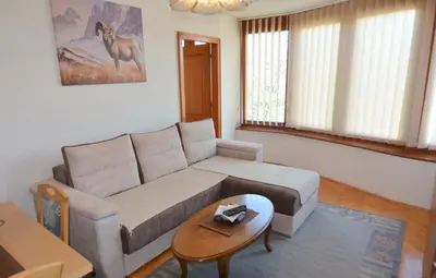a living room with a couch and a table at Apartman Mandić in Vrnjačka Banja