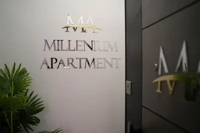 a sign for a milling armenium apartment at Millenium Apartments City Center in Niš