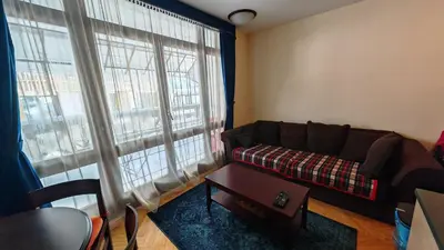 a living room with a couch and a table at Vila Gorica - Planinska kuca in Kopaonik