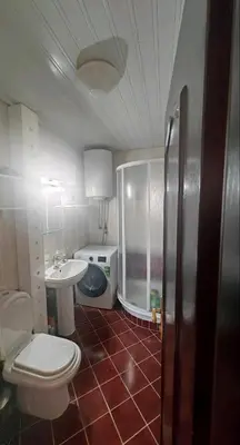 a small bathroom with a toilet and a sink at Vila Gorica - Planinska kuca in Kopaonik