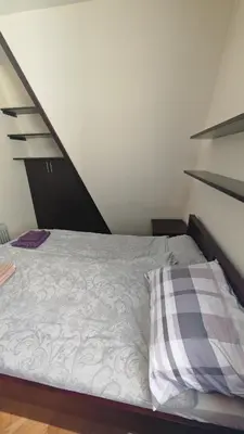 a bed with a pillow in a room at Vila Gorica - Planinska kuca in Kopaonik