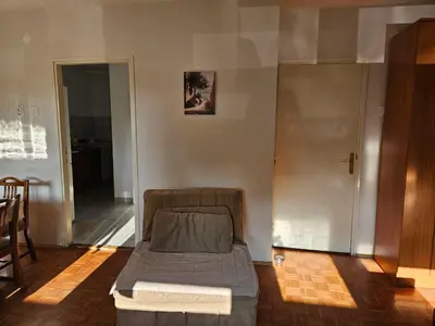 a bed sitting in the middle of a room at DiO in Kruševac