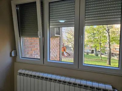 two windows in a room with a view of a construction site at DiO in Kruševac