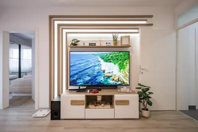 a living room with a flat screen tv on a wall at Pirot LUX 1 in Pirot