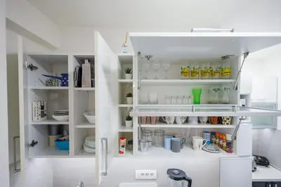 a white pantry with white shelves at Pirot LUX 1 in Pirot