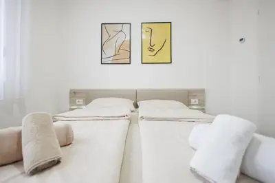 two beds sitting next to each other in a room at Pirot LUX 1 in Pirot