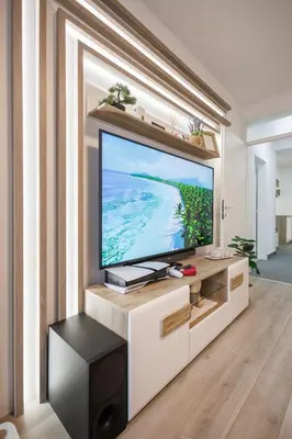 a living room with a large flat screen tv at Pirot LUX 1 in Pirot