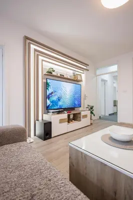 a living room with a flat screen tv at Pirot LUX 1 in Pirot