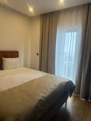 a bedroom with a bed and a large window at N-LUX 66 MILMARI kopaonik in Kopaonik