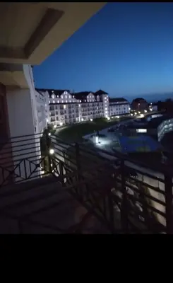 a car is parked on a balcony at night at N-LUX 66 MILMARI kopaonik in Kopaonik