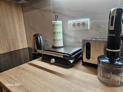 a kitchen counter with a coffee maker and a toaster at Blue Wave Vrnjacka banja in Vrnjačka Banja