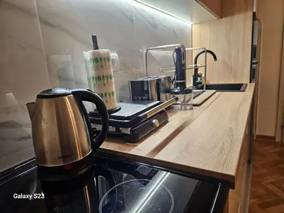 a kitchen counter with a coffee maker on a counter top at Blue Wave Vrnjacka banja in Vrnjačka Banja