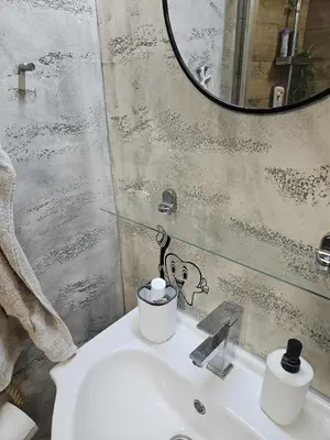 a bathroom with a sink and a mirror at BK Apartment in Niš