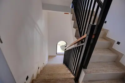 a staircase in a house with a window at Vila Nikola Nature and Mind Retreat House