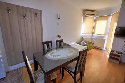a dining room with a table and chairs at Vila Nikola Nature and Mind Retreat House