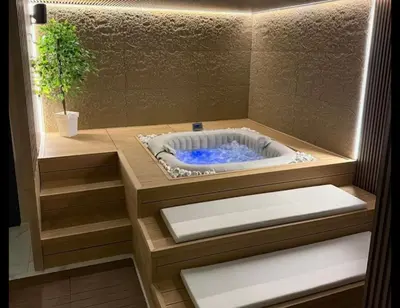 a jacuzzi tub in a bathroom with a plant at Monte LUX 10 in Kopaonik
