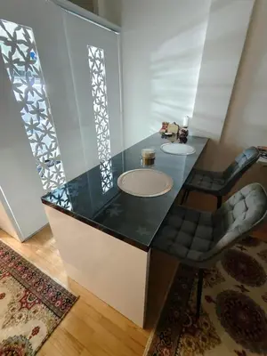 a bathroom with a black counter with a sink at Apartman Lusi Vranje in Vranje