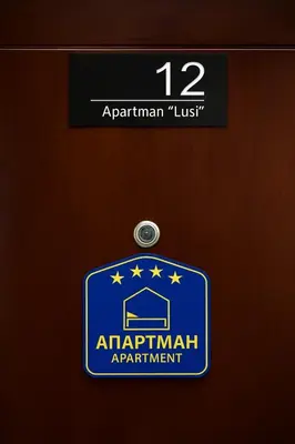 a sign on a door that saysarmaventh apartment at Apartman Lusi Vranje in Vranje