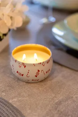 a small candle in a bowl on a table at APARTMAN ANASTASIJA i DANKA in Pirot